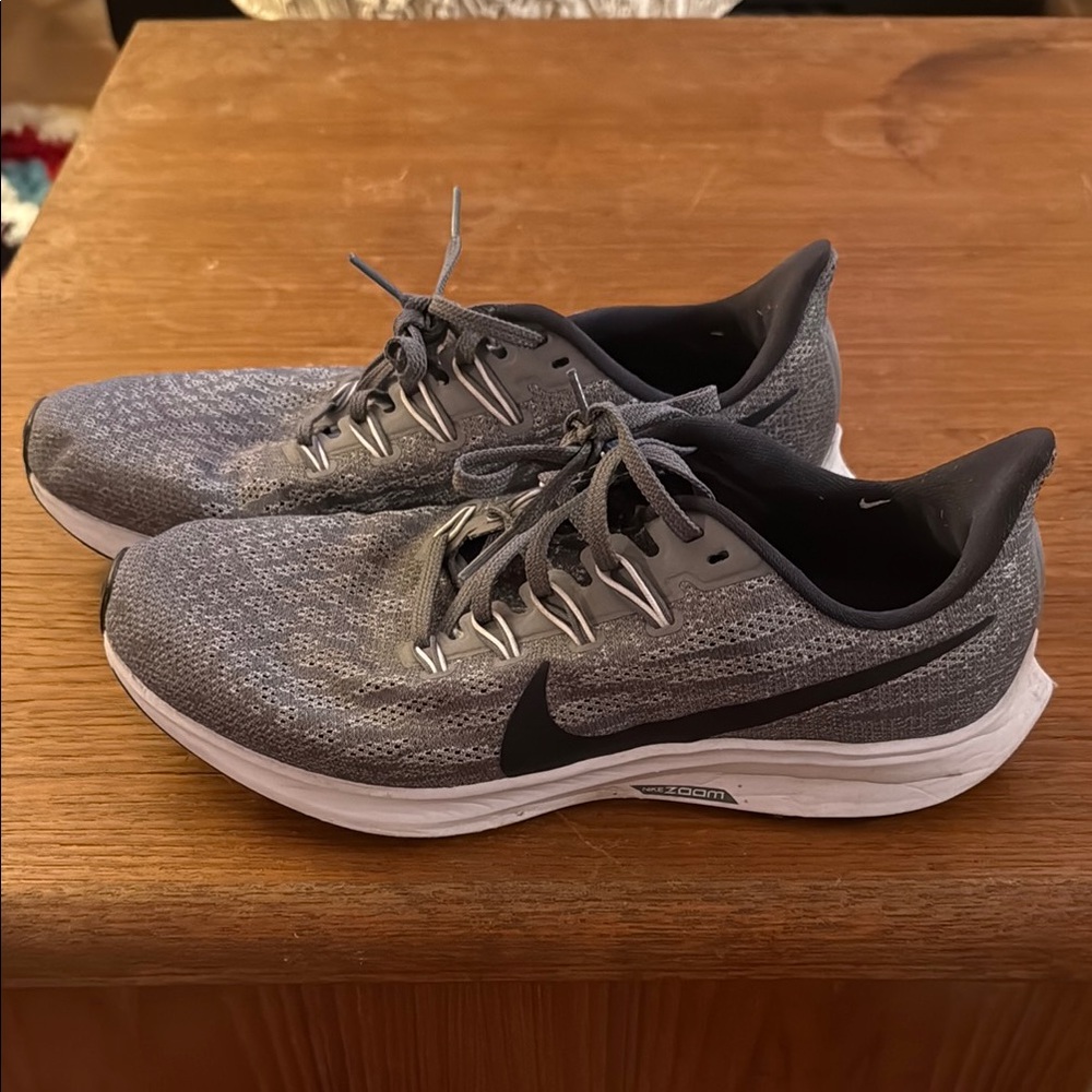 Nike Woman Gray Athletic Running Shoes with Black Swoosh